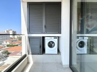 two washing machines sitting on the balcony of a building at STAY Mouson View Apartment in Limassol