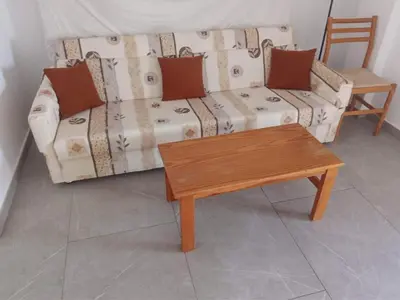 a living room with a couch and a coffee table at Apartment Sun Kapparis in Paralimni