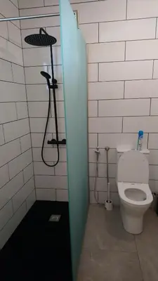 a bathroom with a toilet and a shower stall at Apartment Sun Kapparis in Paralimni