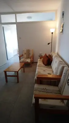 a living room with two beds and a table at Apartment Sun Kapparis in Paralimni
