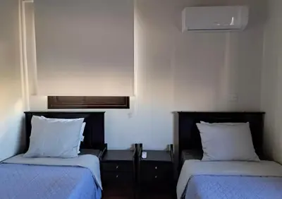 two beds in a room with two pillows at Lama's Residence in Nicosia