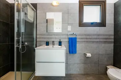 a bathroom with a sink and a shower at Kymma Seaview #24 in Ayia Napa