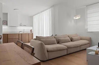 a living room with a couch and a table at Themelio Living 2-Bed Apartment Nicosia City Centre in Nicosia