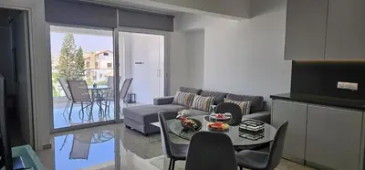 a living room with a couch and a table at AURA Apt Modern 1BR in Central Limassol and Free Parking in Limassol
