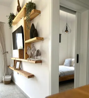 a room with wooden shelves on the wall at Teak Charm in Larnaka