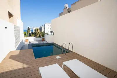 a balcony with a swimming pool on top of a building at Bridge House 301-3BR Penthouse in Limassol