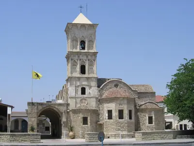 an old building with a clock tower on top of it at The Josephine Boutique Hotel in Larnaka