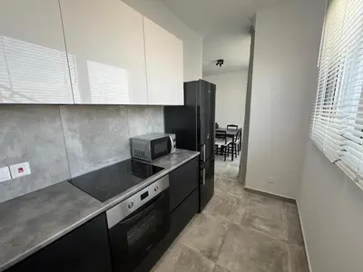 a kitchen with a counter top and a microwave at One Bedroom Penthouse Flat in Larnaka