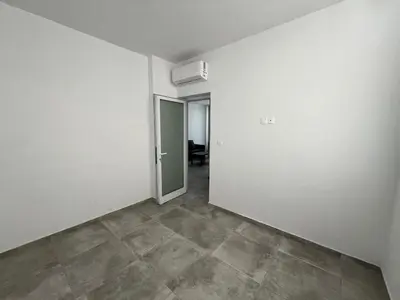 an empty room with white walls and a tile floor at One Bedroom Penthouse Flat in Larnaka