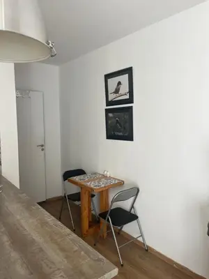 a small table and two chairs in a room at Panos salt lake apartment in Aglantzia