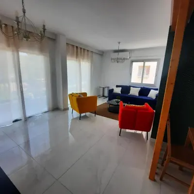a living room with two chairs and a couch at Modern 3BR Family Apartment in Quiet Drosia with Balcony in Larnaka