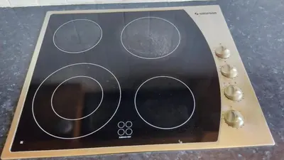 a close up of a microwave with four dials at Poseidon 502 penthouse in Larnaka
