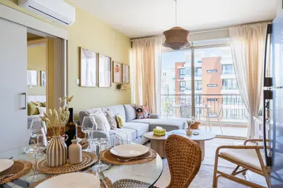 a living room with a couch and a table at Mystique 1-Bedroom Apartment in Larnaka