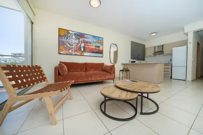 a living room with a couch and a table at Modern 2 bedroom flat in Engomi in Strovolos