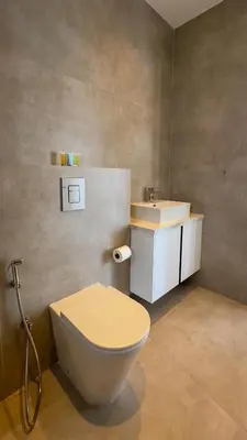 a bathroom with a toilet and a sink at Aqua Beachfront Villas - Villa 1 in Ayia Napa