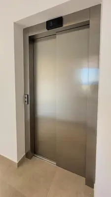 a sliding glass door with a television on top at Aqua Beachfront Villas - Villa 2 in Ayia Napa
