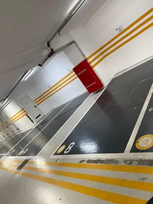 a train station with a red and yellow stripe on the floor at The 1 -Nicosia Luxe Stay- Gym Pool 24h Concierge in Nicosia