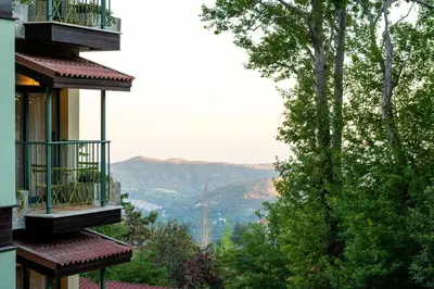 a view of the mountains from a balcony of a building at Petit Palais Platres Boutique Hotel in Platres