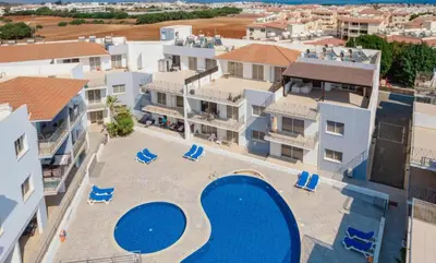 an aerial view of a apartment complex with a swimming pool at Serenity Apartment with Pool in Paralimni