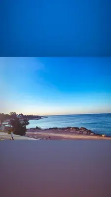 a view of the ocean from a beach at Serenity Apartment with Pool in Paralimni