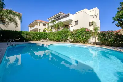 a swimming pool in front of a house at Aether Residence by Nomads in Tersephanou