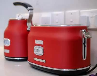 two red toasters sitting next to each other on a counter at Artemis 304 - Seaside Stories in Livadhia