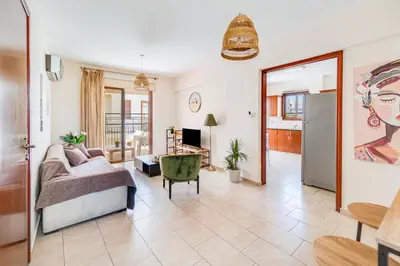 a living room with a bed and a couch at Market View Apartment - Near The Beach in Larnaka