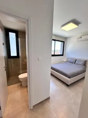 a bedroom with a bed and a toilet at Luxury Elegant Home in Protaras