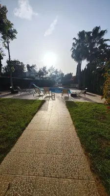 a group of benches sitting in a park at Nissi 87 Apartment - Luxcyservices in Ayia Napa
