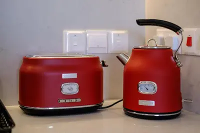 two red toasters sitting next to each other on a counter at Artemis 105 - Seaside Stories in Livadhia