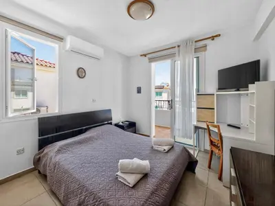 a bedroom with a bed with two pillows on it at Villa Rena - 3BR Retreat near Kalamies Beach in Paralimni