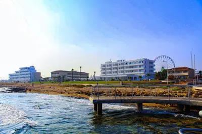 a bridge over a body of water next to a beach at Piere - Anne Beach Hotel in Ayia Napa