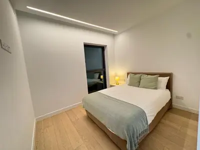 a bedroom with a large bed in a room at SkyHigh Park View Residence in Nicosia