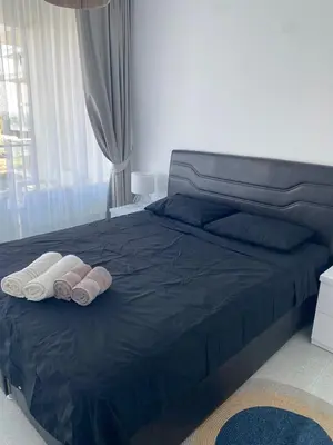 a bedroom with a bed with two towels on it at Northern Cyprus Iskele Bogaz Abelia One plus One Sea View in Boğaz