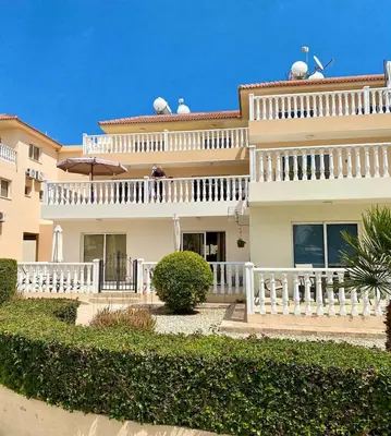 a large white house with a white fence at Golden Sands No10 in Ayia Napa