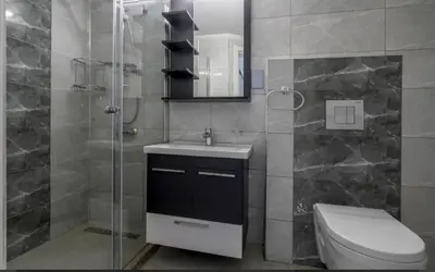 a bathroom with a toilet and a sink and a shower at Avrasya city in Ayios Dhometios