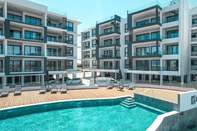 an image of an apartment building with a swimming pool at Carisa Elysium Larnaca in Larnaka