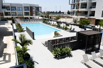 an overhead view of a swimming pool in a building at Cosmos Residence C102 in Paralimni