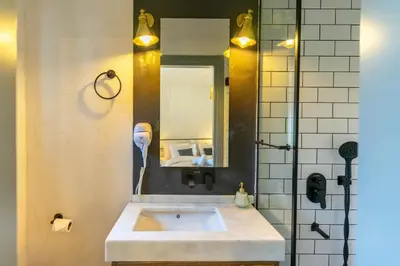 a bathroom with a sink and a mirror at Zalihe Boutique Hotel North Nicosia in Nicosia