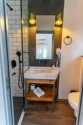 a bathroom with a sink and a mirror at Zalihe Boutique Hotel North Nicosia in Nicosia