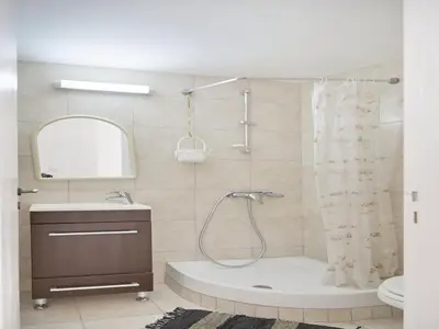 a bathroom with a shower and a sink at Lefkara View in Pano Lefkara