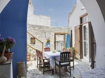 a dining room with a table and chairs at Lefkara View in Pano Lefkara