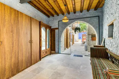 an empty hallway with an archway in a building at Kallistheni - Stylish Studio Apartments in Lefkara in Pano Lefkara