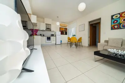 a living room with a couch and a table at Modern 1 bedroom flat in Strovolos