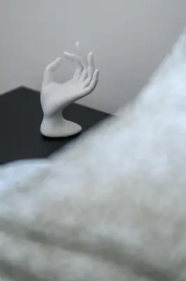 a white hand is sitting on top of a table at Sunny 1-Bedroom Apartment - StaysbyDais in Larnaka