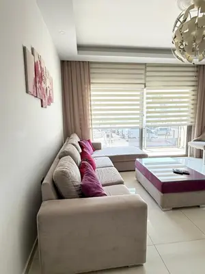 a living room with a couch and a large window at Nicosia's Diamond in Nicosia