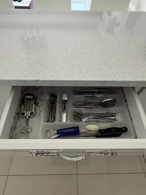 a drawer in a cabinet filled with utensils at Nicosia's Diamond in Nicosia