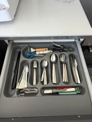 a tray filled with utensils in a drawer at Yenikent's Diamond in Nicosia