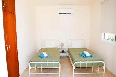 a room with two beds in a room at Agesilaos Seaview 33 in Ayia Napa