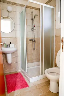 a bathroom with a shower and a toilet and a sink at Agesilaos Seaview 33 in Ayia Napa